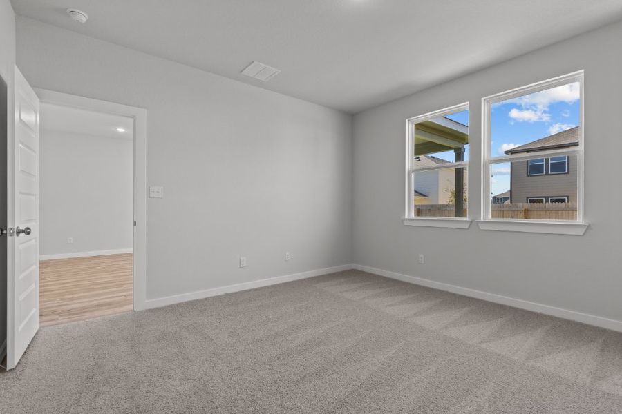 A room with a window and a door.