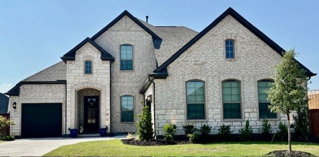 Front exterior of a new home in Canyon Falls 70s, Northlake, TX, highlighting curb appeal (Image 1). Front exterior of a new home in Canyon Falls 70s, Northlake, TX, highlighting curb appeal (Image 1).