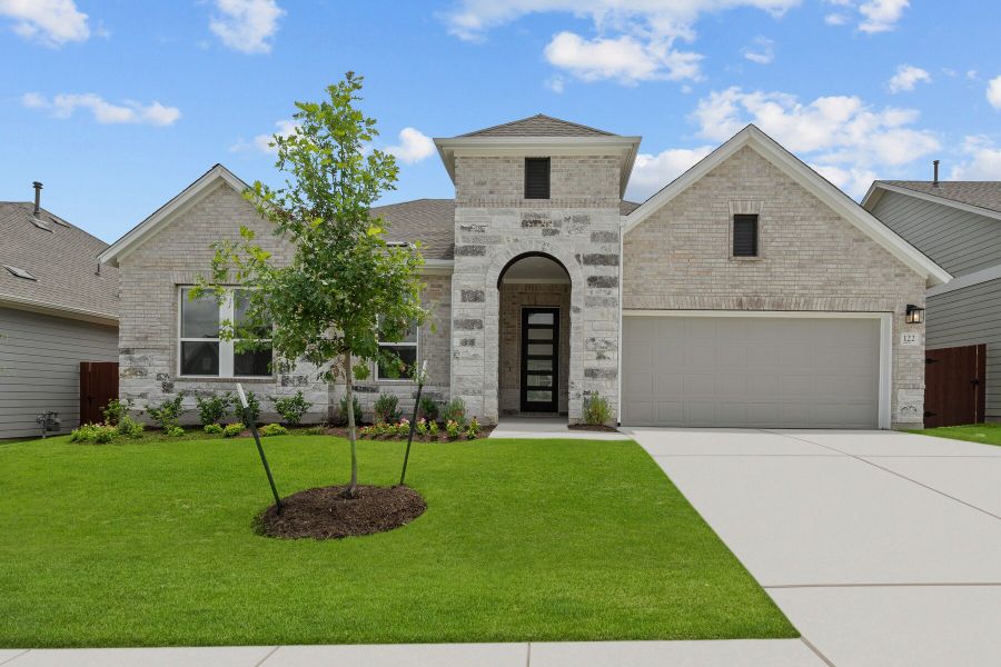 Representative exterior photo of a completed home built from the The Carrington by David Weekley Homes in Sunfield, Buda, TX (Image 2). Representative exterior photo of a completed home built from the The Carrington by David Weekley Homes in Sunfield, Buda, TX (Image 2).