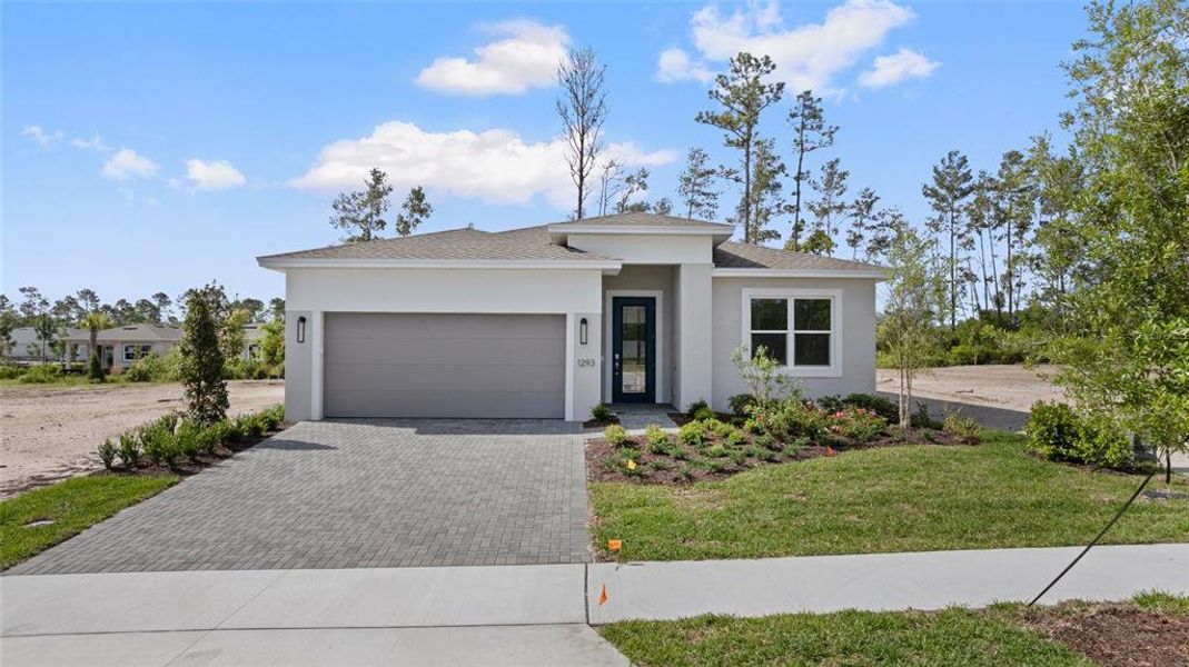 Front exterior of a new home in Cresswind DeLand, Deland, FL, highlighting curb appeal (Image 1). Front exterior of a new home in Cresswind DeLand, Deland, FL, highlighting curb appeal (Image 1).