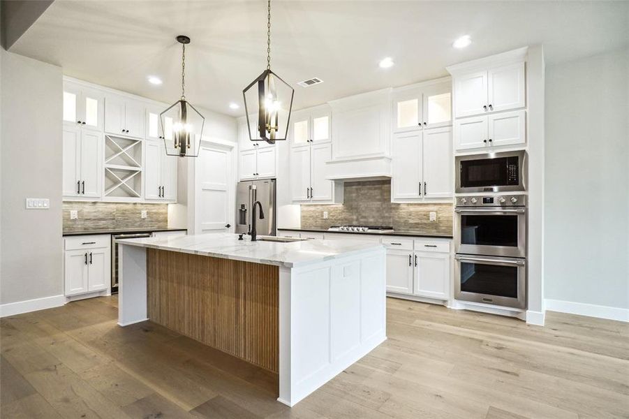 Beautifully appointed kitchen has all the bells and whistles you could want. Double ovens with microwave anchor this large kitchen Beautifully appointed kitchen has all the bells and whistles you could want. Double ovens with microwave anchor this large kitchen