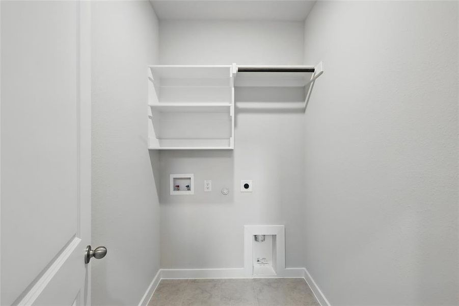 Laundry area with electric dryer hookup, washer hookup, and hookup for a gas dryer