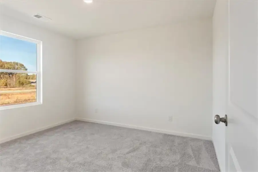 Spacious, unfurnished interior of a new home in The Ridge at Twin Rivers, Covington (Image 27).
