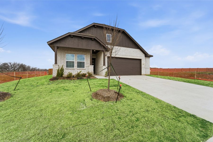Front exterior of a new home in Saddlebrook Estates, Waxahachie, TX, highlighting curb appeal (Image 2).