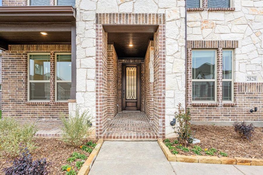 Exterior details and patio area of a home in Villages of Hurricane Creek, Anna (Image 3).