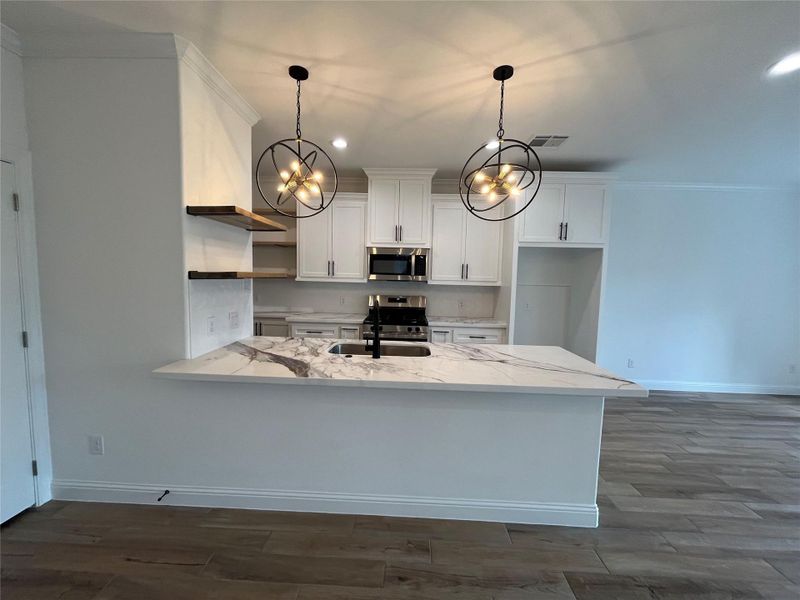 Furnished interior view inside a new home in , Conroe (Image 6).