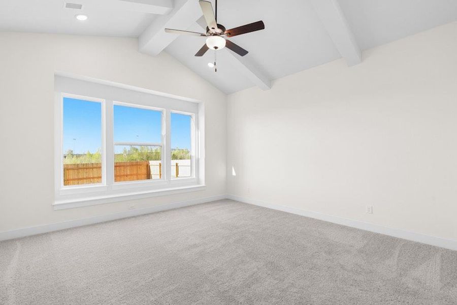 Unfurnished room featuring light carpet and a ceiling fan Unfurnished room featuring light carpet and a ceiling fan