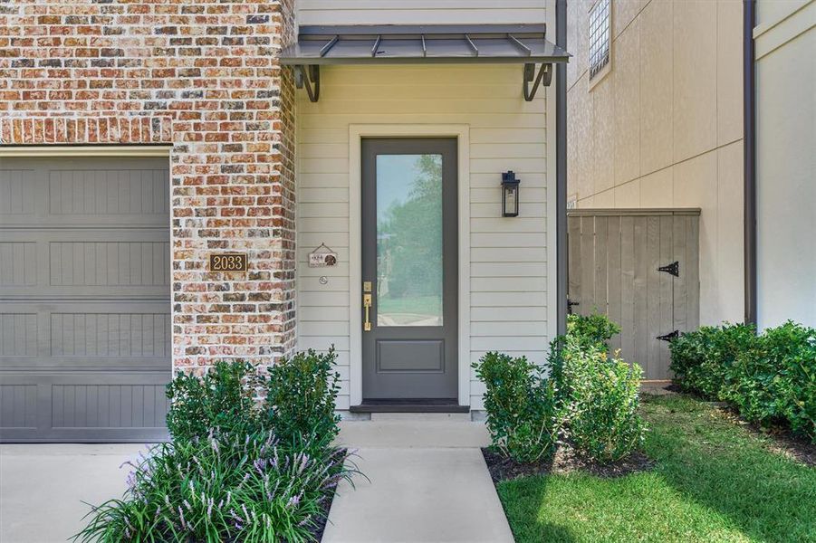 Stunning red brick exterior and a well manicured landscaping creates charming curb appeal for this Pelican Builders home!