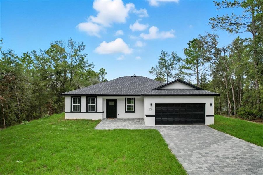 Front exterior of a new home in , Citrus Springs, FL, highlighting curb appeal (Image 23).