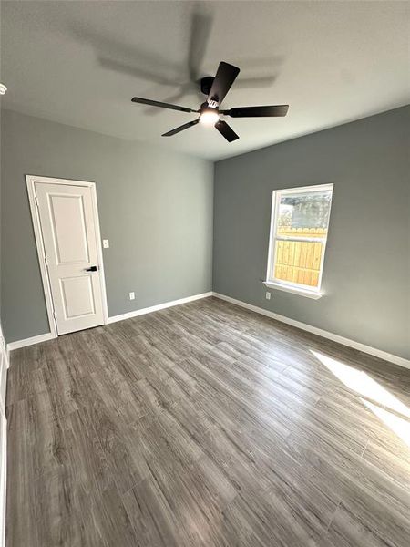 Spare room featuring hardwood / wood-style floors and ceiling fan