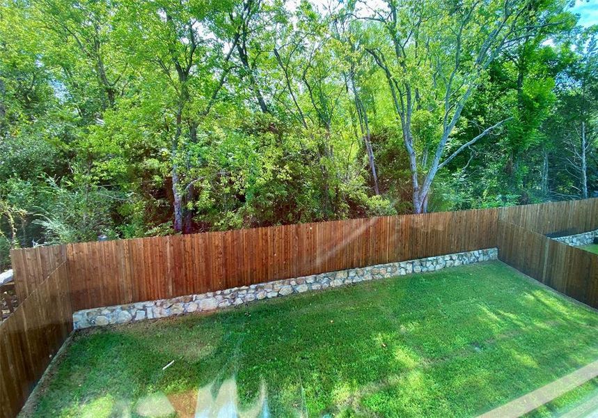 Great view of private back yard with large trees behind from upstairs window Great view of private back yard with large trees behind from upstairs window