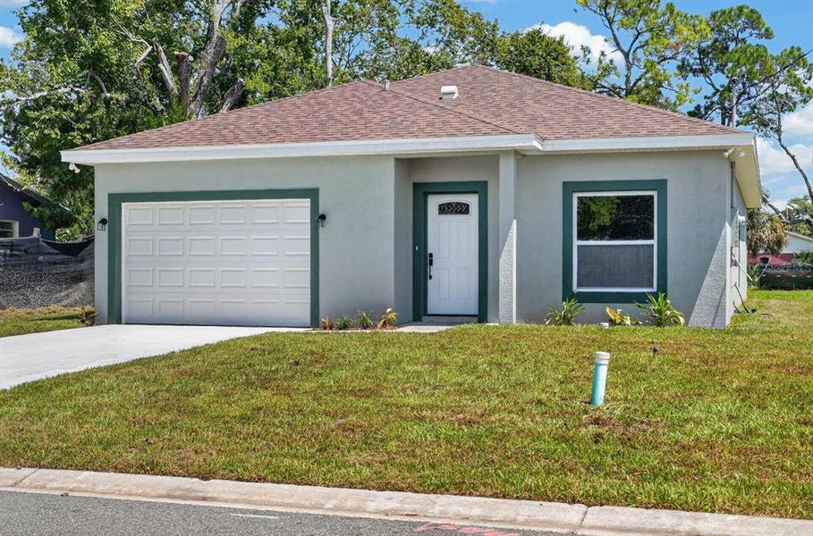 Front exterior of a new home in , Daytona Beach, FL, highlighting curb appeal (Image 21). Front exterior of a new home in , Daytona Beach, FL, highlighting curb appeal (Image 21).