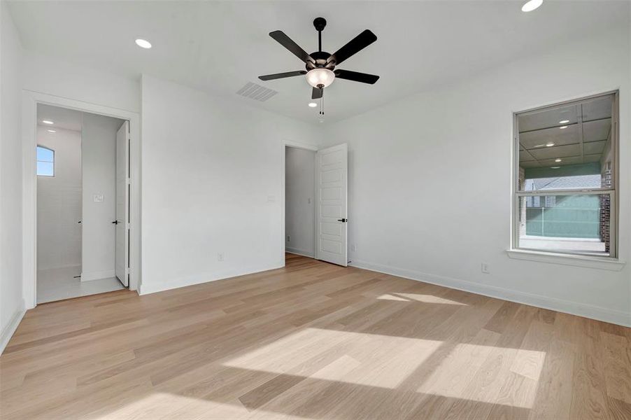 Unfurnished bedroom featuring recessed lighting, light wood finished floors, and ceiling fan Unfurnished bedroom featuring recessed lighting, light wood finished floors, and ceiling fan