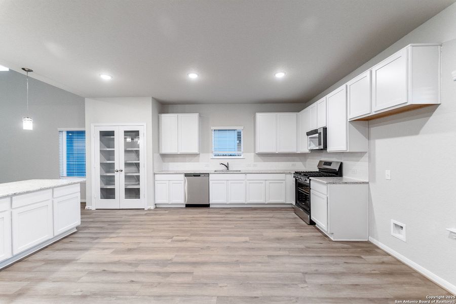 Furnished interior view inside a new home in Hennersby Hollow, San Antonio (Image 6).