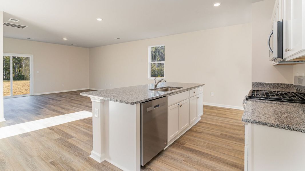 Representative furnished interior of a home built from the WREN by D.R. Horton in Saltgrass Landing, Winnabow (Image 8).