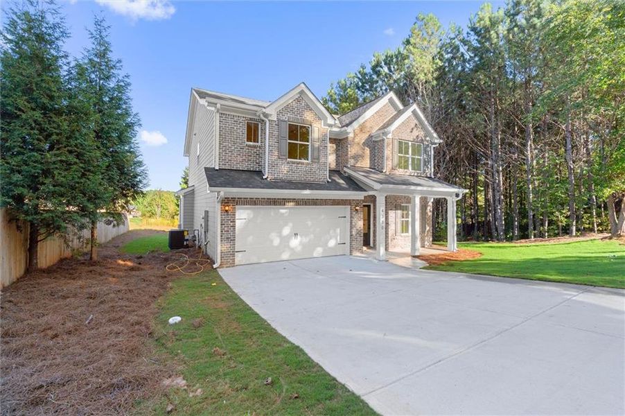 Front exterior of a new home in , Douglasville, GA, highlighting curb appeal (Image 24). Front exterior of a new home in , Douglasville, GA, highlighting curb appeal (Image 24).