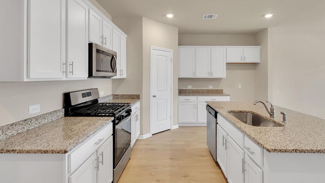 Furnished interior view inside a new home in Bar W Ranch, Leander (Image 7).