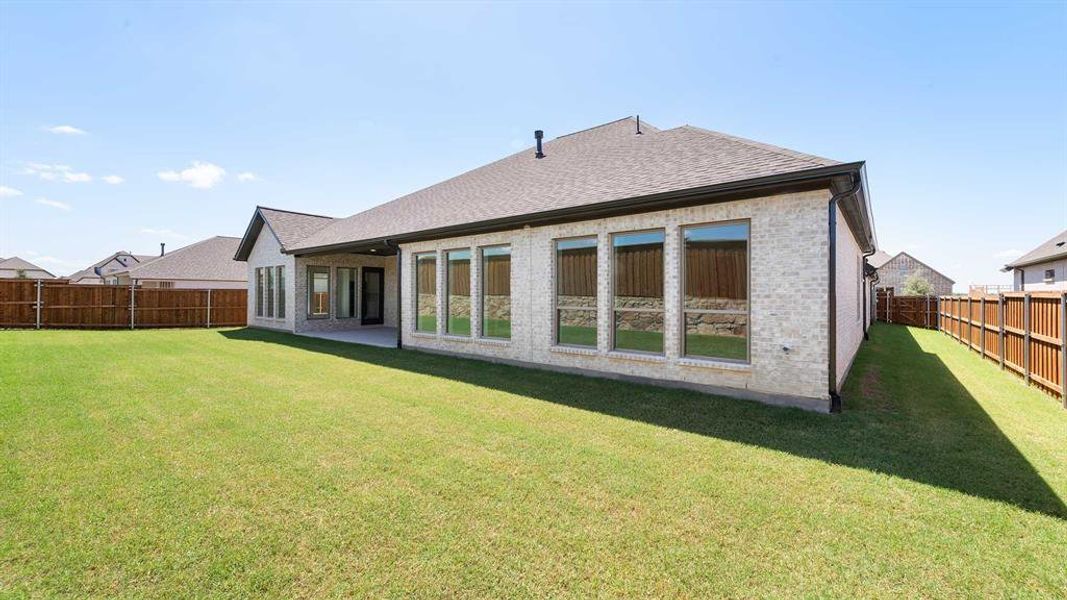 Front exterior of a new home in Terraces 72', Rockwall, TX, highlighting curb appeal (Image 2). Front exterior of a new home in Terraces 72', Rockwall, TX, highlighting curb appeal (Image 2).