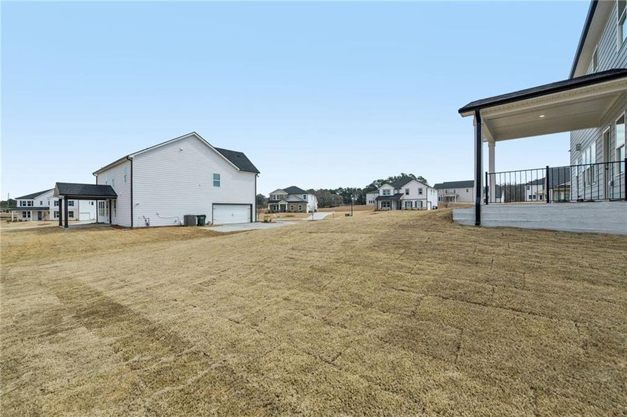 Exterior details and patio area of a home in River Pointe, Monroe (Image 30).