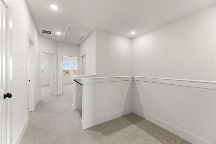 The loft at the top of the stairs makes a perfect pocket office or reading nook.