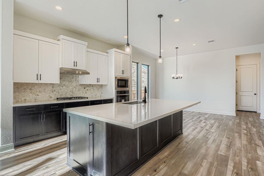 Furnished interior view inside a new home in 6 Creeks, Kyle (Image 3).