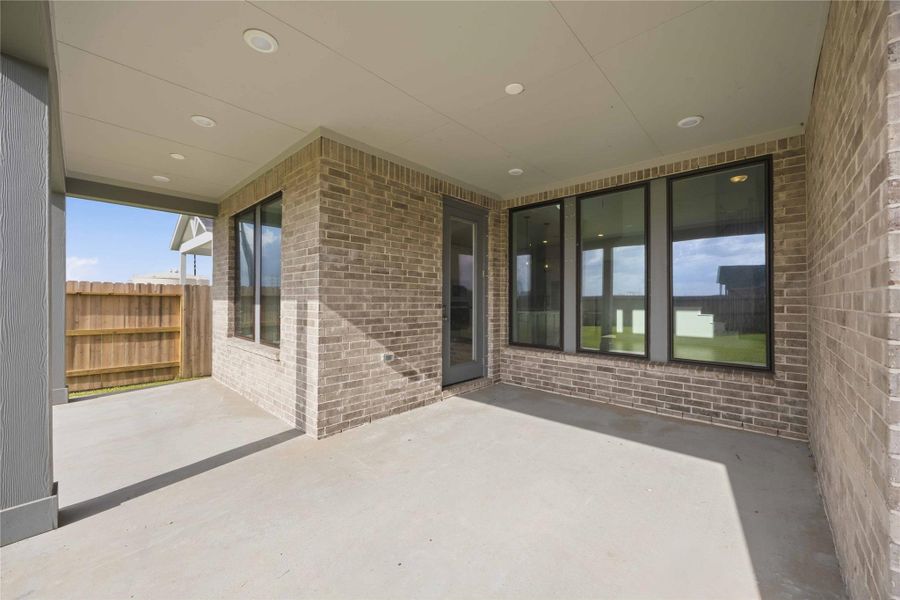 Exterior details and patio area of a home in Ellwood, Iowa Colony (Image 3). Exterior details and patio area of a home in Ellwood, Iowa Colony (Image 3).