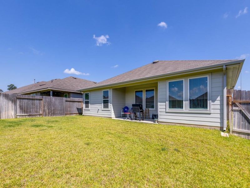Exterior details and patio area of a home in Grand Pines, Magnolia (Image 21).