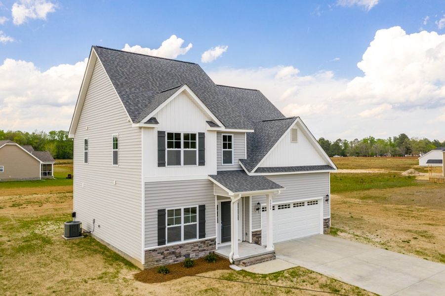 Representative exterior photo of a completed home built from the Ryder by Bill Clark Homes in Arbor Hills South II, Greenville, NC (Image 24). Representative exterior photo of a completed home built from the Ryder by Bill Clark Homes in Arbor Hills South II, Greenville, NC (Image 24).