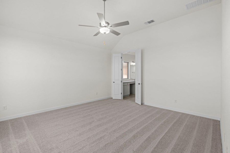 Primary Bedroom with elevated ceiling