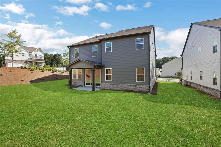 Exterior details and patio area of a home in The Paddocks at Doc Hughes, Buford (Image 30).