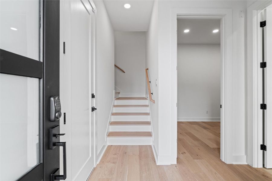 A study in simplicity and intention, the entryway unfolds with quiet elegance—anchored by wide-plank white oak floors and crisp architectural lines. Just off the foyer, a versatile first-floor suite awaits, equally suited as a private guest retreat or a serene home office. This is a space designed not just for arrival, but for immediate ease. A study in simplicity and intention, the entryway unfolds with quiet elegance—anchored by wide-plank white oak floors and crisp architectural lines. Just off the foyer, a versatile first-floor suite awaits, equally suited as a private guest retreat or a serene home office. This is a space designed not just for arrival, but for immediate ease.