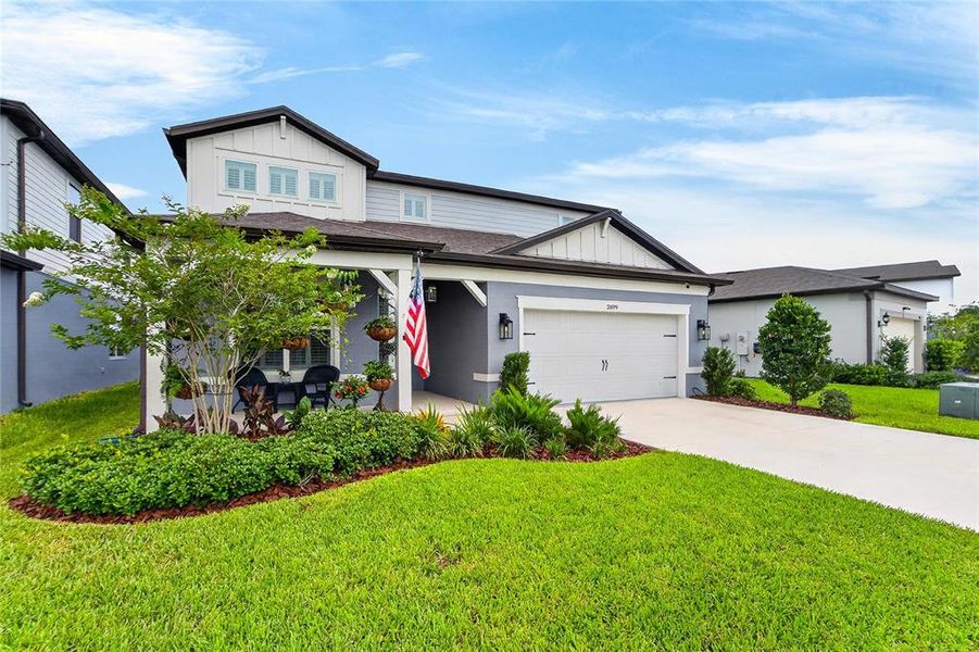 Front exterior of a new home in , Land O' Lakes, FL, highlighting curb appeal (Image 28). Front exterior of a new home in , Land O' Lakes, FL, highlighting curb appeal (Image 28).