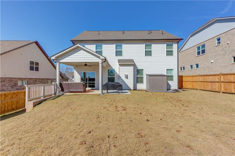 Exterior details and patio area of a home in Cambridge, Flowery Branch (Image 27).