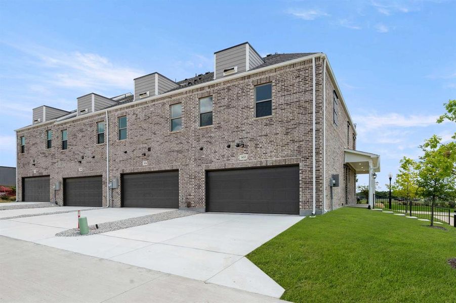 Front exterior of a new home in Parkside, Mansfield, TX, highlighting curb appeal (Image 27). Front exterior of a new home in Parkside, Mansfield, TX, highlighting curb appeal (Image 27).