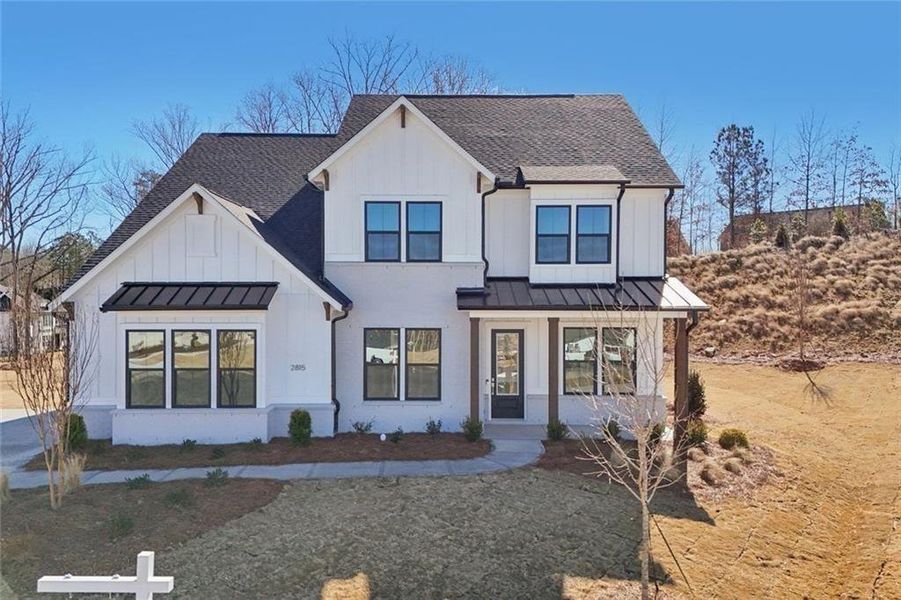 Front exterior of a new home in Sterling Pointe, Cumming, GA, highlighting curb appeal (Image 27).