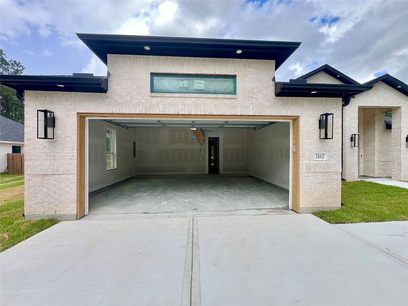 Front exterior of a new home in , Dayton, TX, highlighting curb appeal (Image 1).