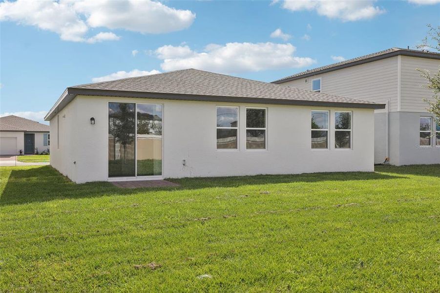 Exterior details and patio area of a home in Lawson Dunes - Signature Series, Haines City (Image 23).