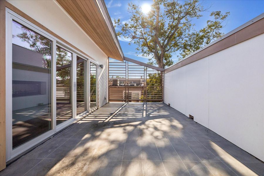 Exterior details and patio area of a home in , Houston (Image 2). Exterior details and patio area of a home in , Houston (Image 2).