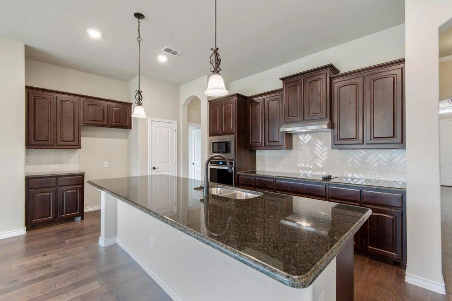 Kitchen | Concept 2671 at Mockingbird Hills in Joshua, TX by Landsea Homes