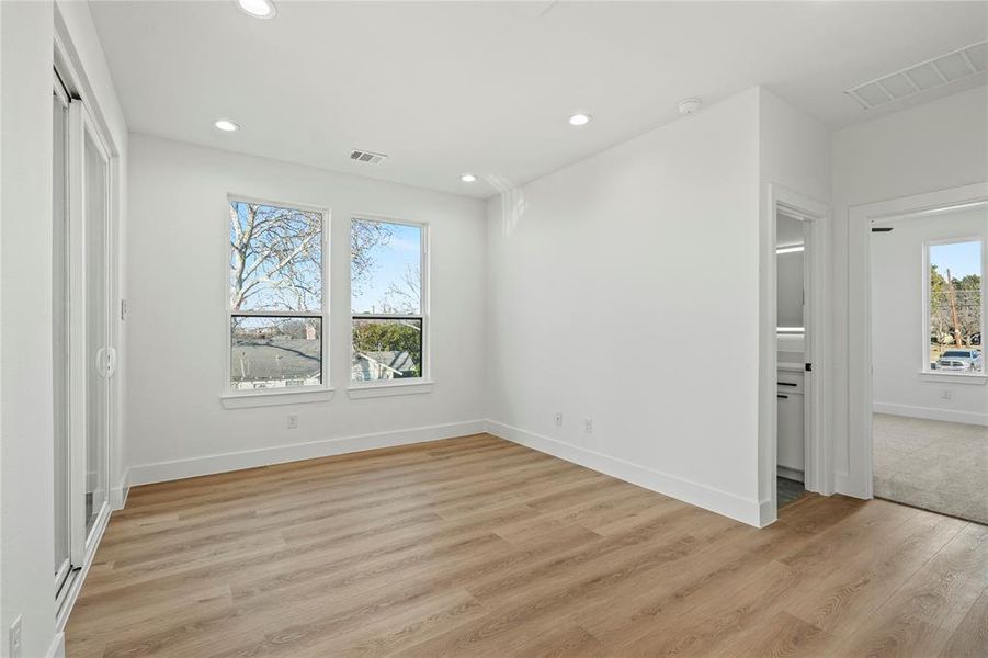 Unfurnished bedroom featuring recessed lighting and light wood-style flooring