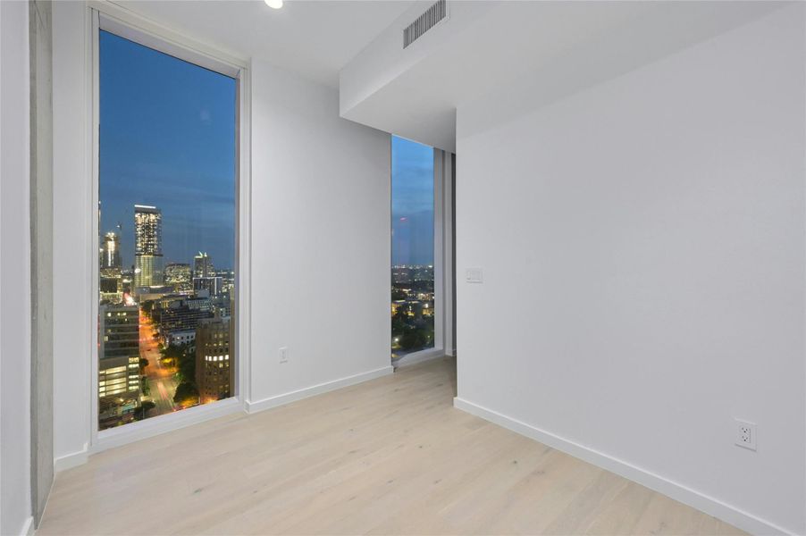 The den can serve as a versatile space, ideal for use as an office or study while enjoying the panoramic views of Austin downtown. The den can serve as a versatile space, ideal for use as an office or study while enjoying the panoramic views of Austin downtown.