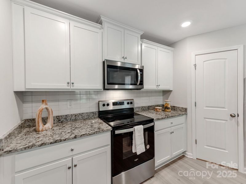 Furnished interior view inside a new home in McKee Creek Village, Charlotte (Image 6). Furnished interior view inside a new home in McKee Creek Village, Charlotte (Image 6).