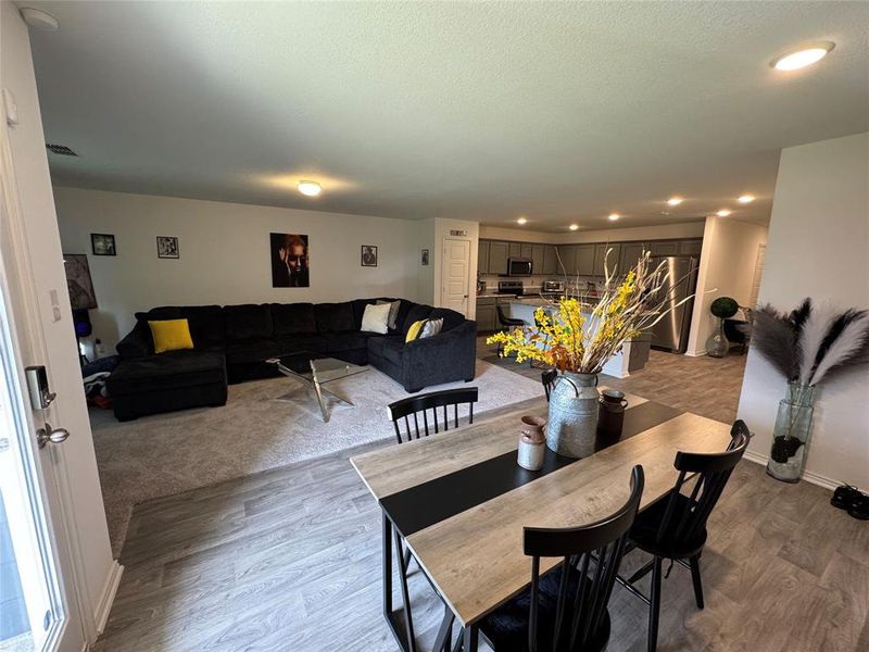 Dining room with light colored carpet