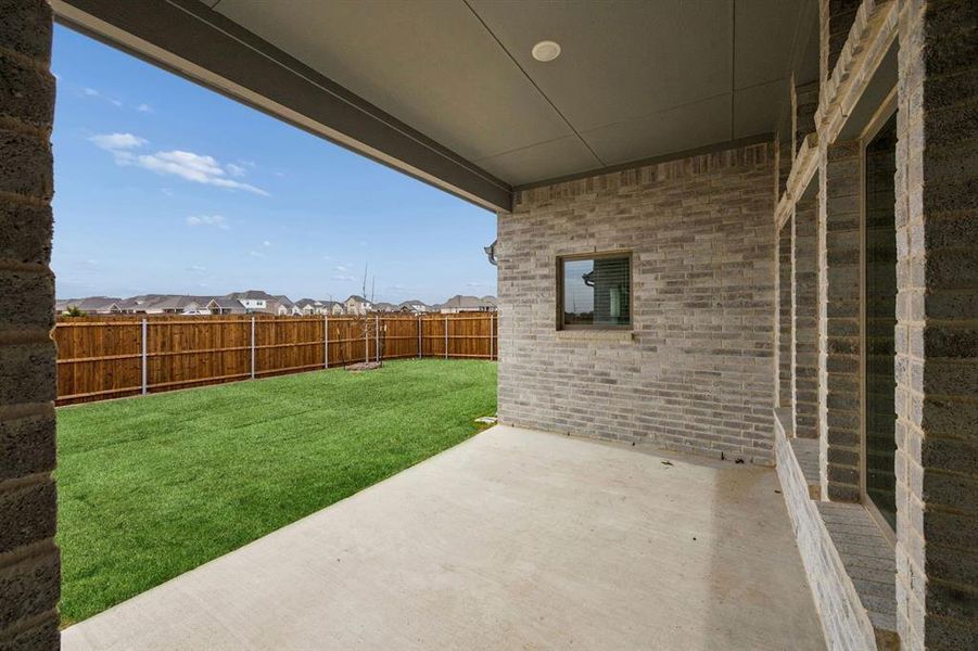 Covered Patio in the Gilmour II home plan by Trophy Signature Homes – REPRESENTATIVE PHOTO Covered Patio in the Gilmour II home plan by Trophy Signature Homes – REPRESENTATIVE PHOTO