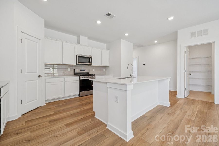 Furnished interior view inside a new home in Meadow Creek Village, Locust (Image 8).