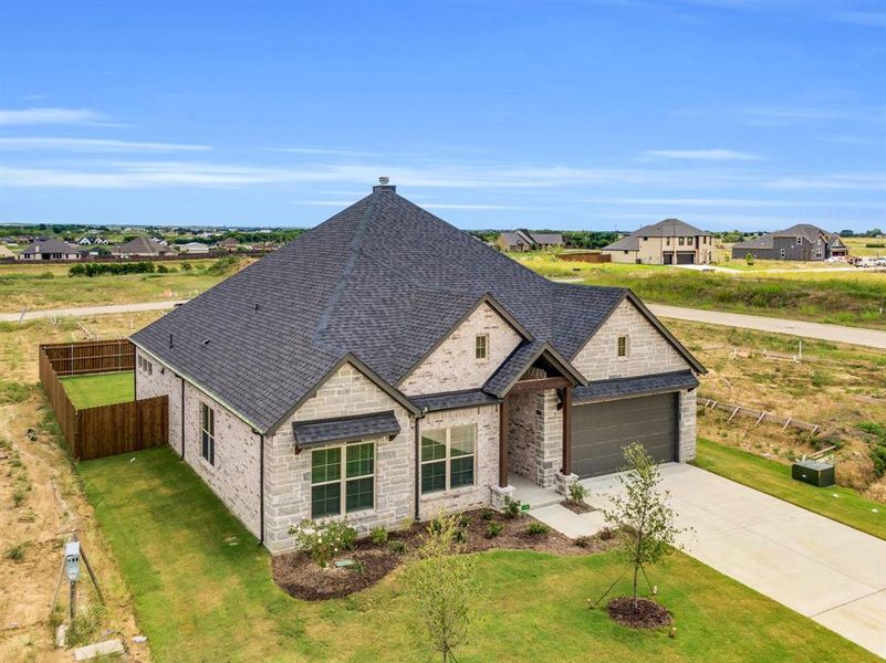 Front exterior of a new home in , Venus, TX, highlighting curb appeal (Image 1). Front exterior of a new home in , Venus, TX, highlighting curb appeal (Image 1).