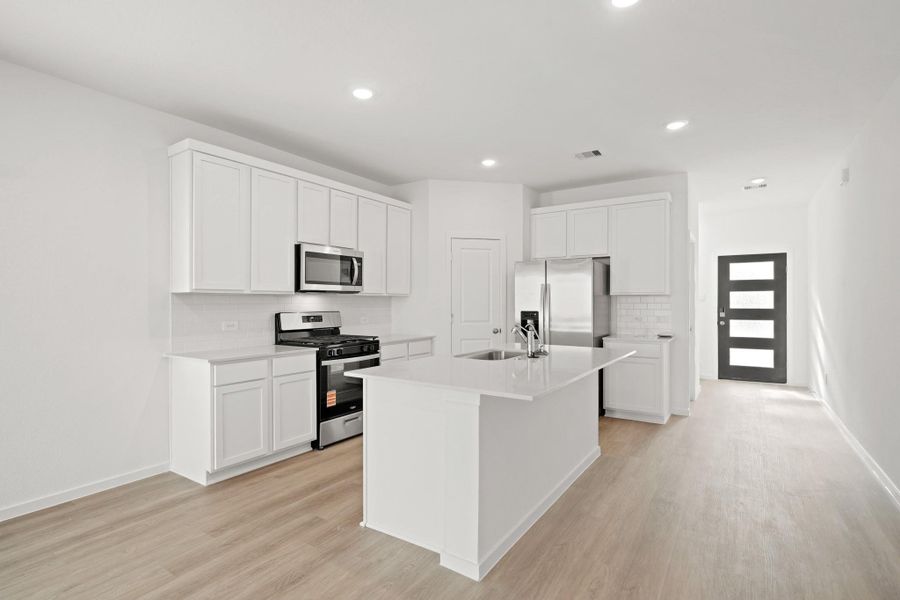 Furnished interior view inside a new home in Sunterra Lakes, Katy (Image 6).