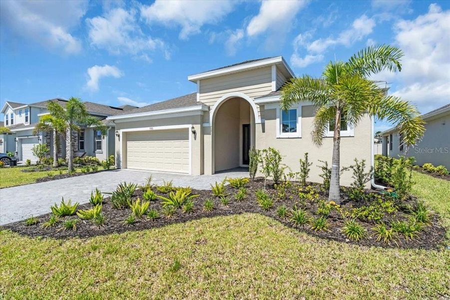 Front exterior of a new home in , Venice, FL, highlighting curb appeal (Image 13).