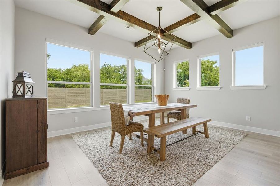 The Beamed Ceiling And Designer Lighting Add Character To The Dining Area Where There's Plentiful Space For Family Gatherings And Entertaining.  The View Outside Is Awesome As Well.