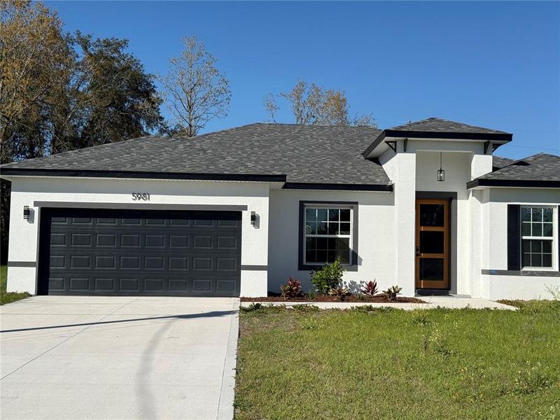 Front exterior of a new home in , Ocala, FL, highlighting curb appeal (Image 1).